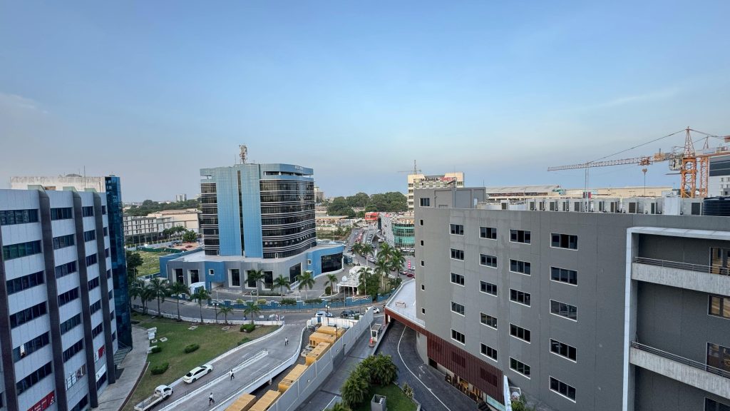 This image features a modern skyline view of Accra, the capital city of Ghana. Highlighting Ghana travel and tourism growth, business growth, and destination for corporate and conference travel.